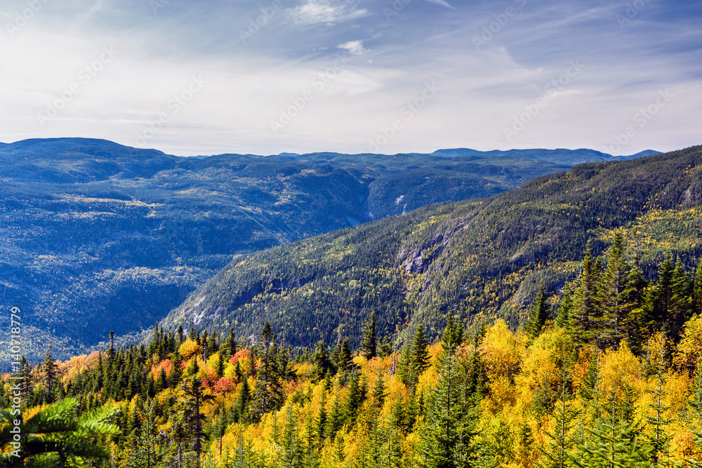 Scenic landscape in autumn on top of mountain with colorful trees