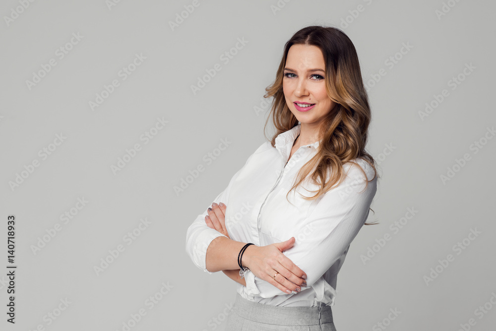 Young businesswoman posing against white background Young businesswoman posing against white background