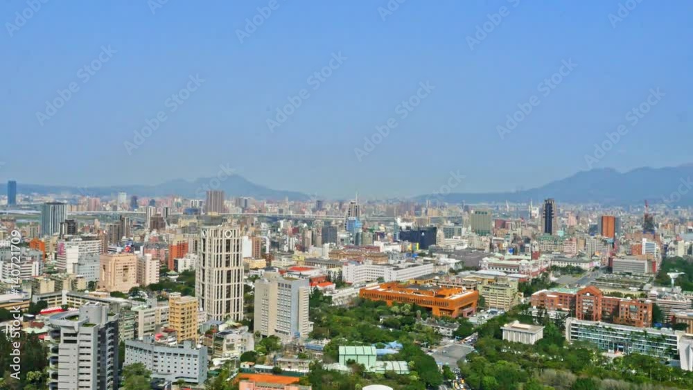 Aerial view of Taipei city, located in the north of the island of Taiwan. On the horizon you can appreciate the mountains. There is vegetation and parks around the buildings. 4K Aerial view of Taipei city, located in the north of the island of Taiwan. On the horizon you can appreciate the mountains. There is vegetation and parks around the buildings. 4K