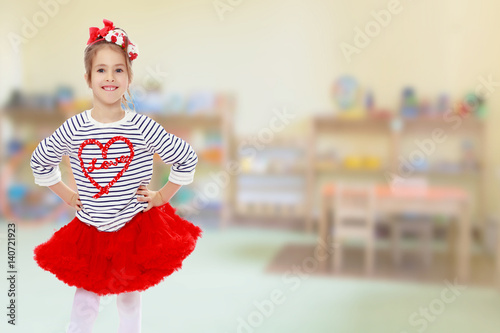 The little girl in the red skirt. photo