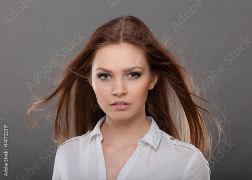 Obraz na plátne Attractive brunette woman with windblown hair