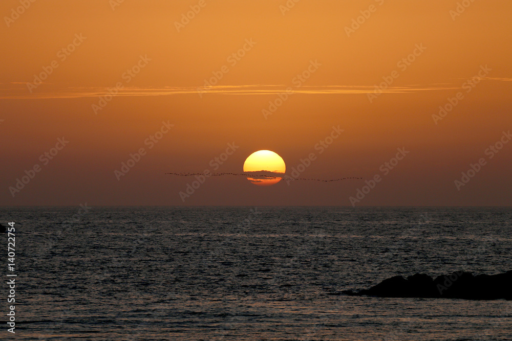 sunset in winter, cloudy sky red sea