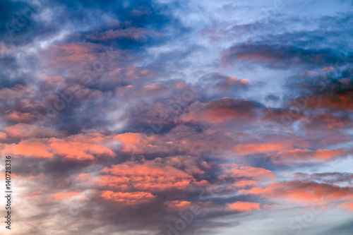 Sky Blue Pink - The setting sun paints a cloudy sky with dramatic and colorful tones.