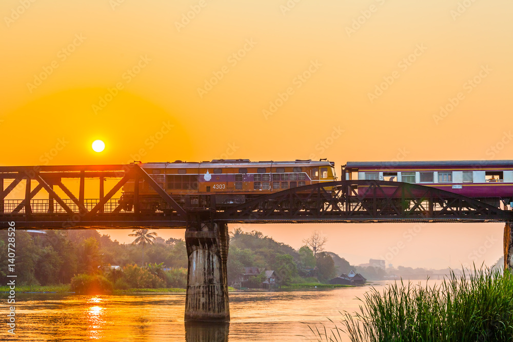 Obraz premium The train is passing through the Death Railway Bridge over the River Kwai in Kanchanaburi.During World War Two Japan constructed railway from Thailand to Buma This is now know the Death Railway.