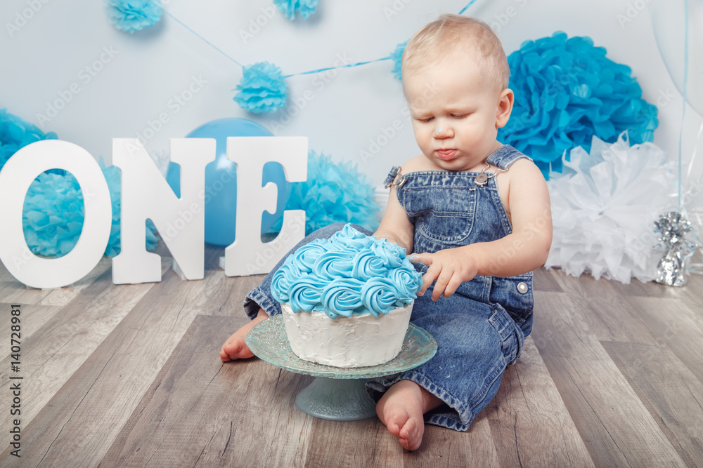 Portrait of cute adorable blond Caucasian baby boy with blue eyes