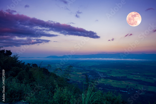 The full moon in the evening after sunset. Outdoors at nighttime. © kdshutterman