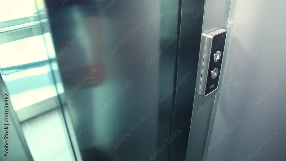 Man's hand push the elevator button Man's hand push the elevator button