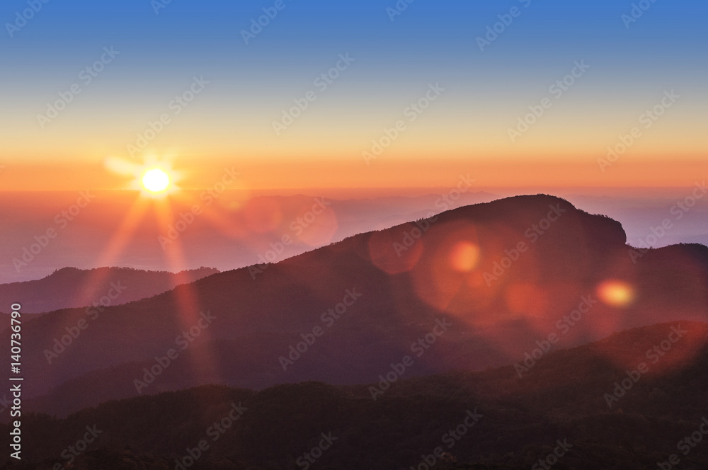 Beautiful landscape sunrise sky with flare at mountain. / doiinthanon Chiang Mai Thailand