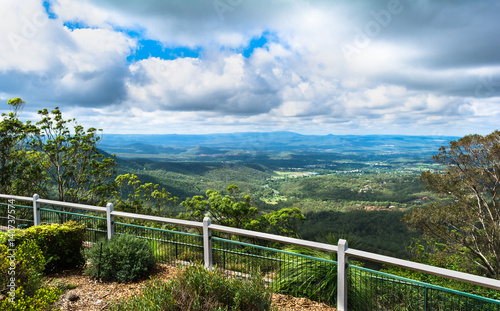 The panoramic view in sunny day with big culumus clouds on montains from Picnic Point Lookout in Toowoomba, Australia