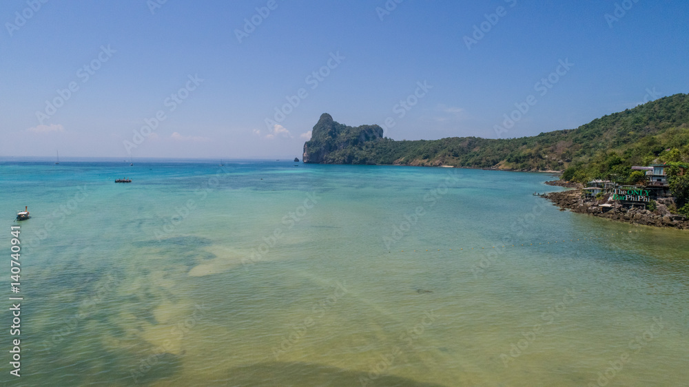 Aerial drone photo of the sea and coastline from iconic tropical beach of Phi Phi island, Thailand Aerial drone photo of the sea and coastline from iconic tropical beach of Phi Phi island, Thailand