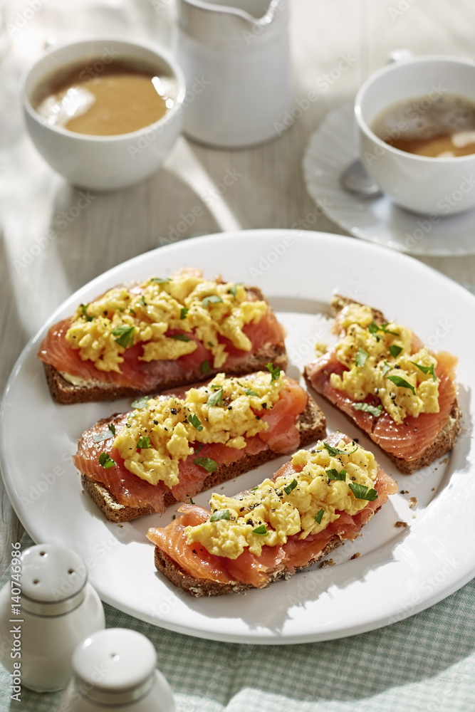 Brown soda bread with scrambled eggs and salmon