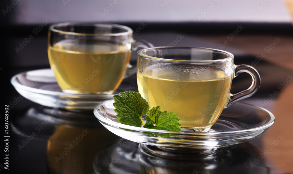 Herbal dry sri lanka tea. Mint leaf. Tea in a glass cup, mint leaves, dried tea, in a restaurant or teahouse Herbal dry sri lanka tea. Mint leaf. Tea in a glass cup, mint leaves, dried tea, in a restaurant or teahouse