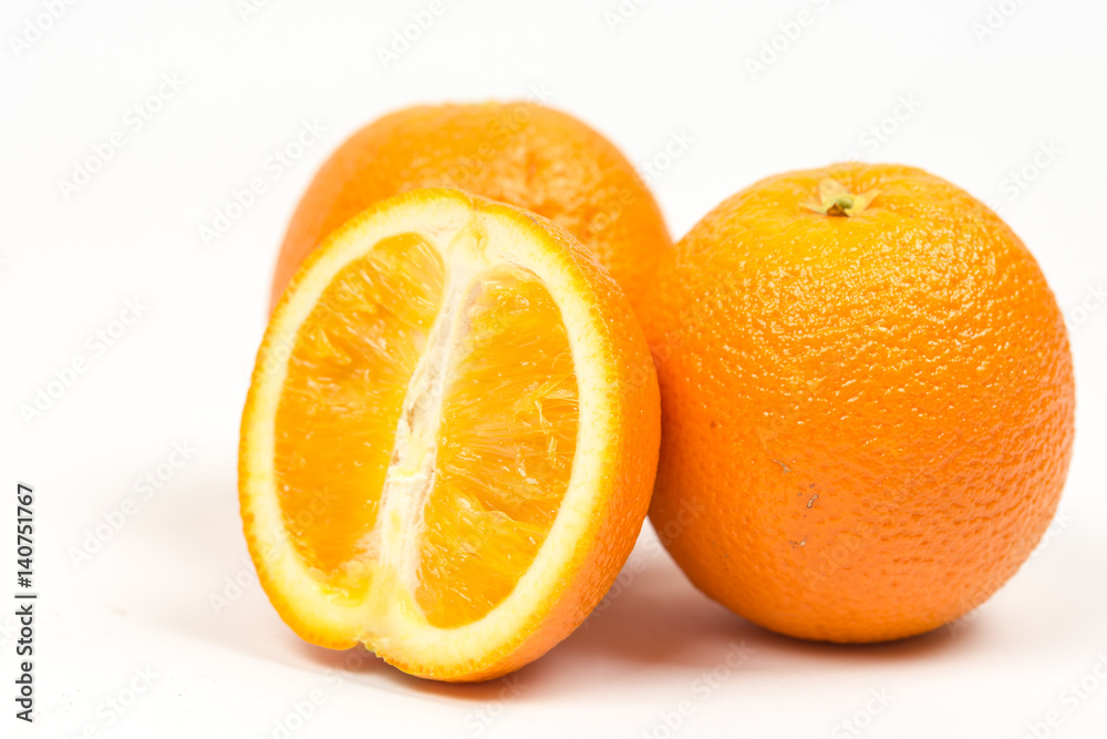 Three sliced oranges isolated over white background Three sliced oranges isolated over white background