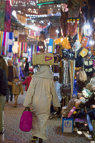 Man carrying bag through streets of Marrakech