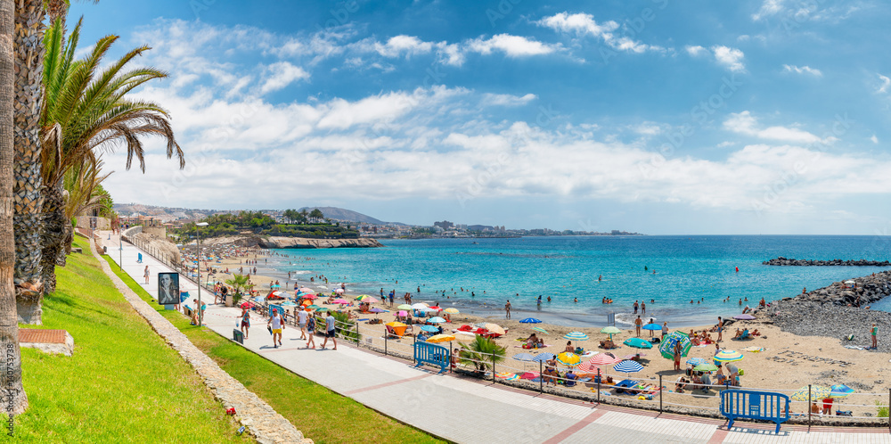 Obraz premium TENERIFE, SPAIN - SEPTEMBER 4, 2016: Panoramic view of Los Cristianos Beach. Tenerife is a major sea destination in Europe