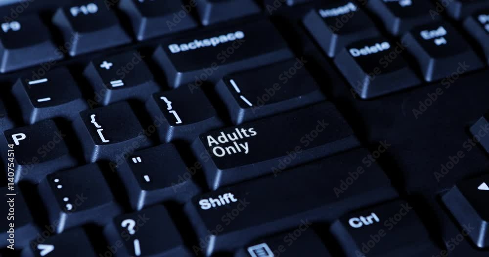 Male finger pressing an Adult Only button on the computer keyboard Male finger pressing an Adult Only button on the computer keyboard