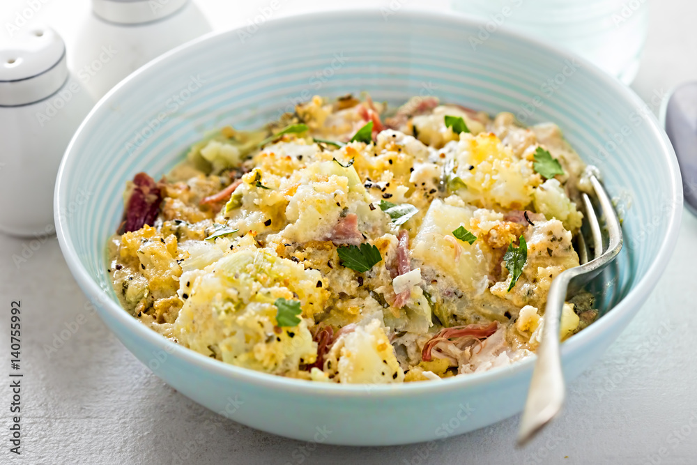 Chicken and ham in mustard and parsley sauce, potato and leek topping and Cheddar cheese and mustard ciabatta crumb Chicken and ham in mustard and parsley sauce, potato and leek topping and Cheddar cheese and mustard ciabatta crumb