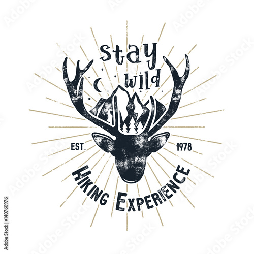 Hand drawn vintage camping badge and hiking label with hiking design elements and typography - stay wild. Vector design