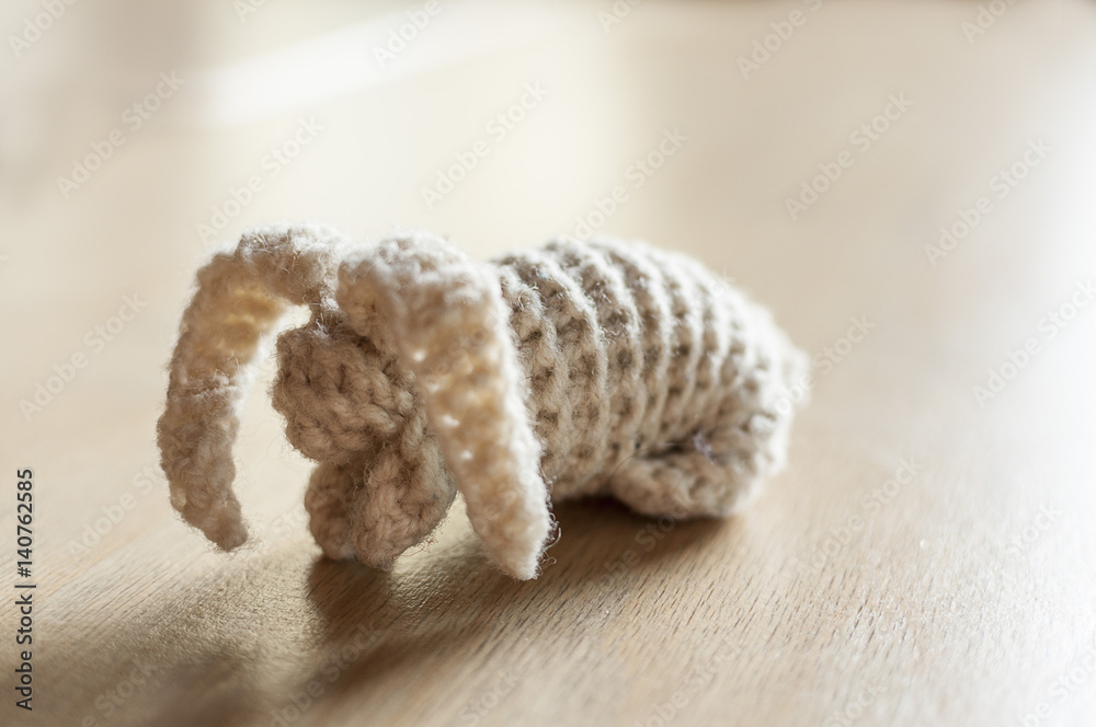 White rabbit on wooden table. Handmade stuffed toy. White rabbit on wooden table. Handmade stuffed toy.