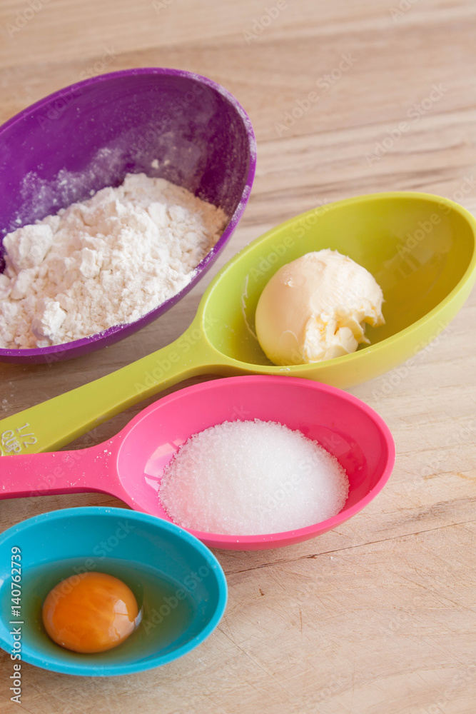 baking recipe ingredients table top view with measuring spoons and kitchen table baking recipe ingredients table top view with measuring spoons and kitchen table