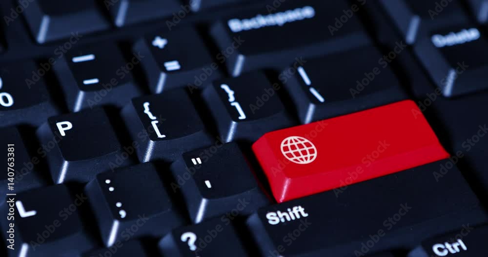 Video footage of a male hand pressing a red button on the computer keyboard with browsing icon