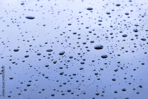 Blue surface with water drops