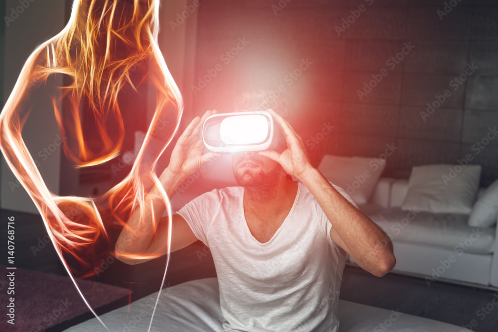 Young man with VR headset playing with fiery sexy woman silhouette, virtual  reality foto de Stock | Adobe Stock