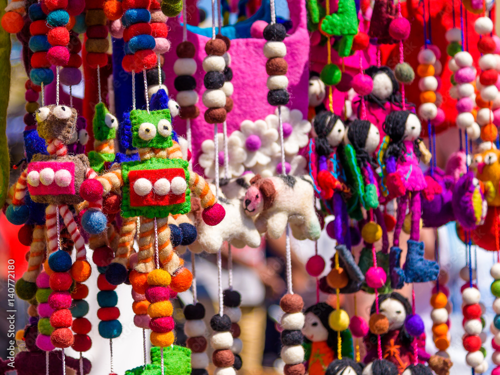 Fototapeta premium Childrens colorful soft toys hanging on strings at a market stall in Melbourne Australia