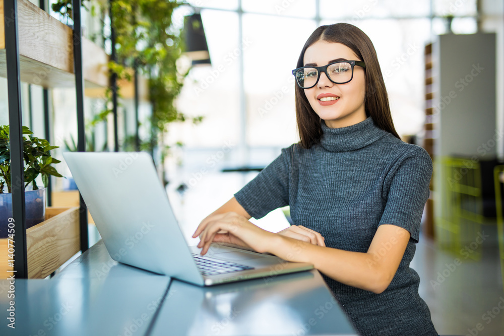 Student work process concept. Woman working university project with generic design laptop. Student work process concept. Woman working university project with generic design laptop.
