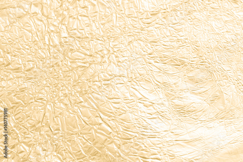 Gold wrinkled paper texture abstract background