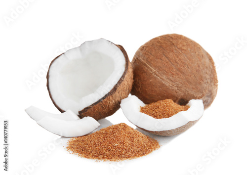 Heap of brown sugar and coconut on white background