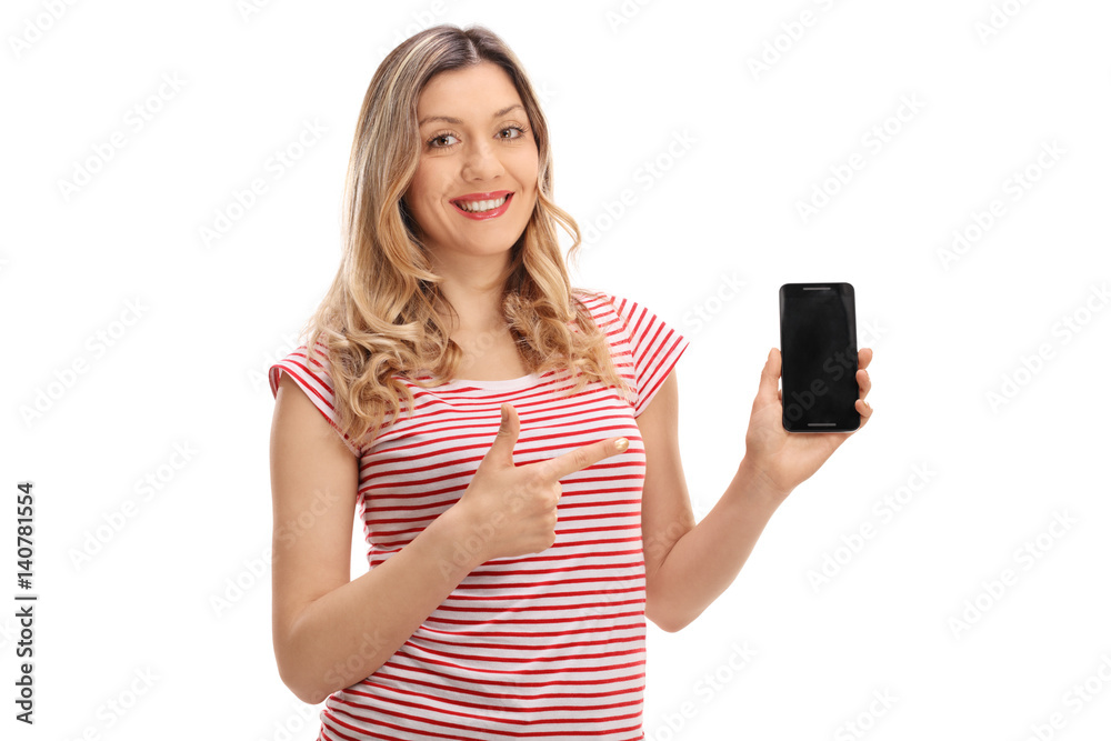 Happy young woman holding a phone and pointing Happy young woman holding a phone and pointing