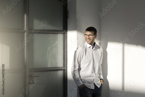 Portrait of a young man wearing glasses