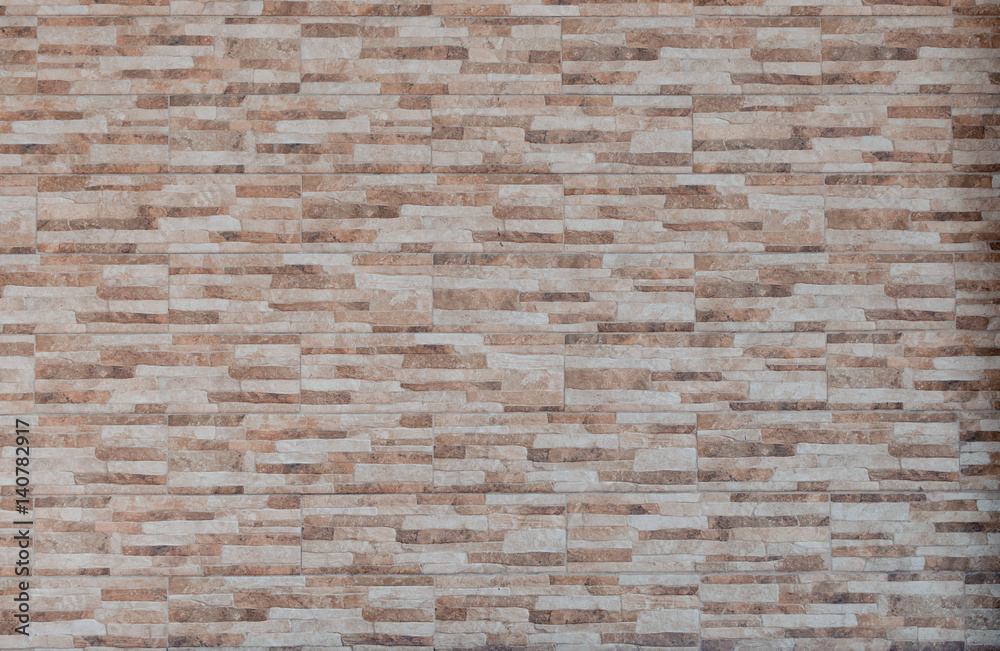 Graphic texture brick wall with coloured stones Graphic texture brick wall with coloured stones