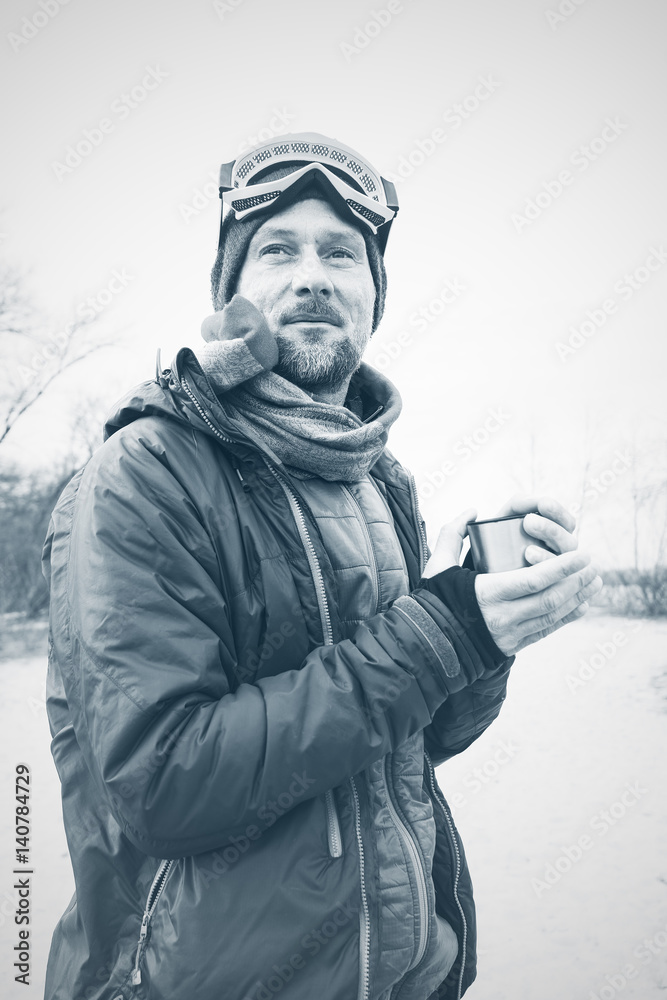 Fototapeta premium Adventurer drinks coffee at the moment of inspiration