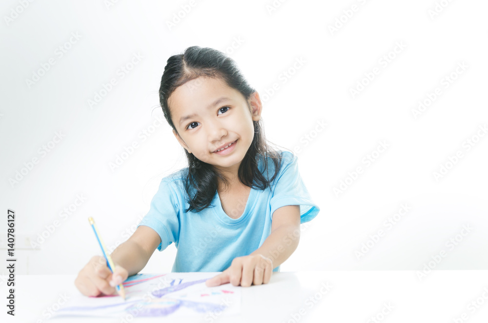 Portrait of smile Asian little girl drawing with color pencil Portrait of smile Asian little girl drawing with color pencil