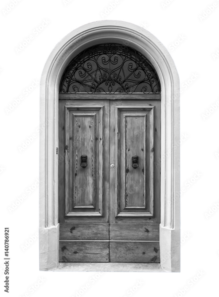 Wooden door in an old Italian house, isolated on white background, clipping path. Black and white.
