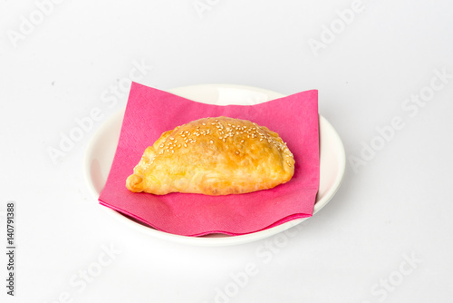 Heap of small chebureks isolated on white background photo