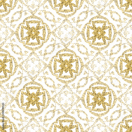 Seamless golden ethnic pattern of dots. A pockmarked background of geometric shapes and stylized plant elements.