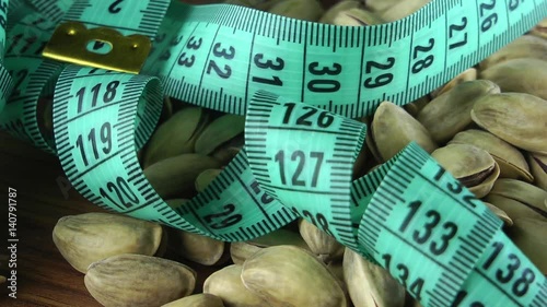 1920x1080 25 Fps. Very Nice Roasted Pistachio And Tape Measure Turning 11 Video photo