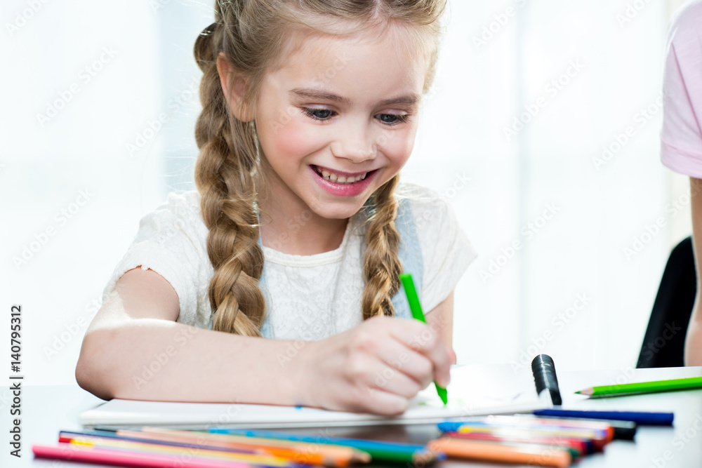 Happy mother and daughter drawing at home Happy mother and daughter drawing at home