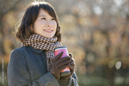 Young woman with tumbler