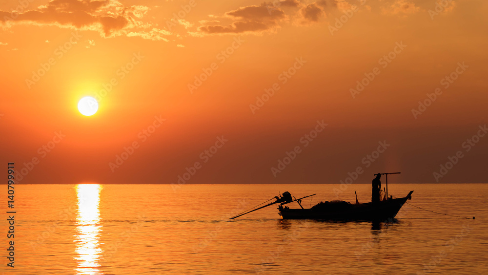Silhouette fishing boat in the sea at sunrise landscape
