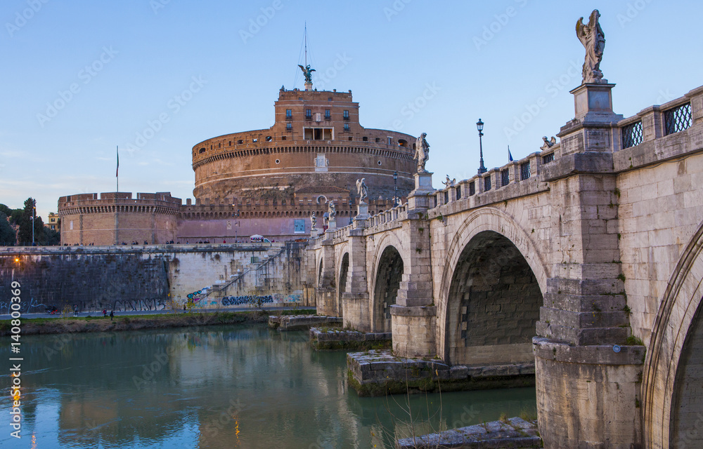 Castle of Holy Angel (Castel Sant Angelo)  and Holy Angel Bridge over the Tiber River in Rome at sunset. Italy, Europe 