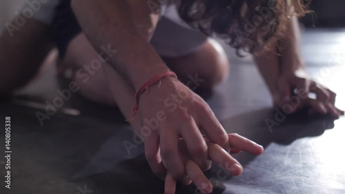 Dancer improvising an intimate dance on the floor photo