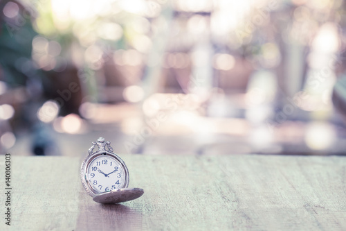 vintage pocket watch on wood table