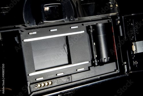 SLR camera body opened back lid to film position © Satakorn