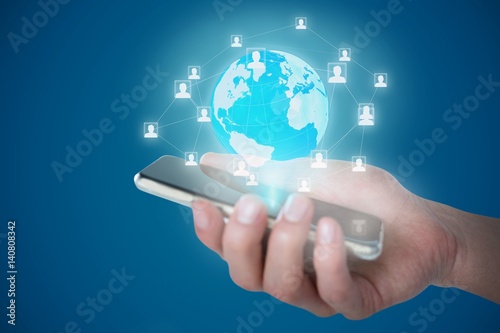 Composite image of cropped image of person holding mobile phone