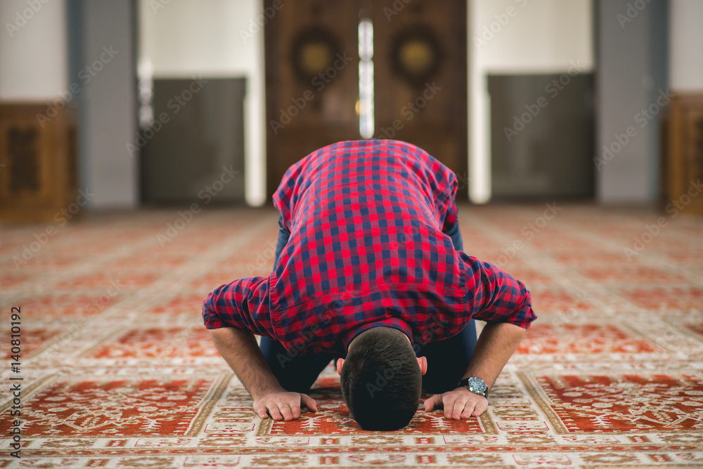 Muslim prostrating in prayer with his fore-head on the floor Stock ...
