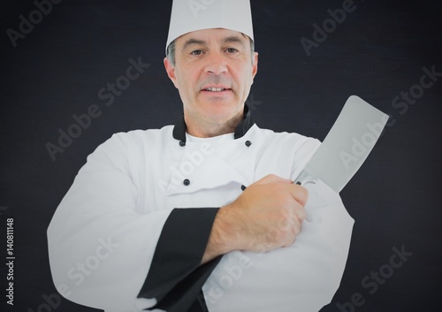 Composite image of Chef with knife against navy background